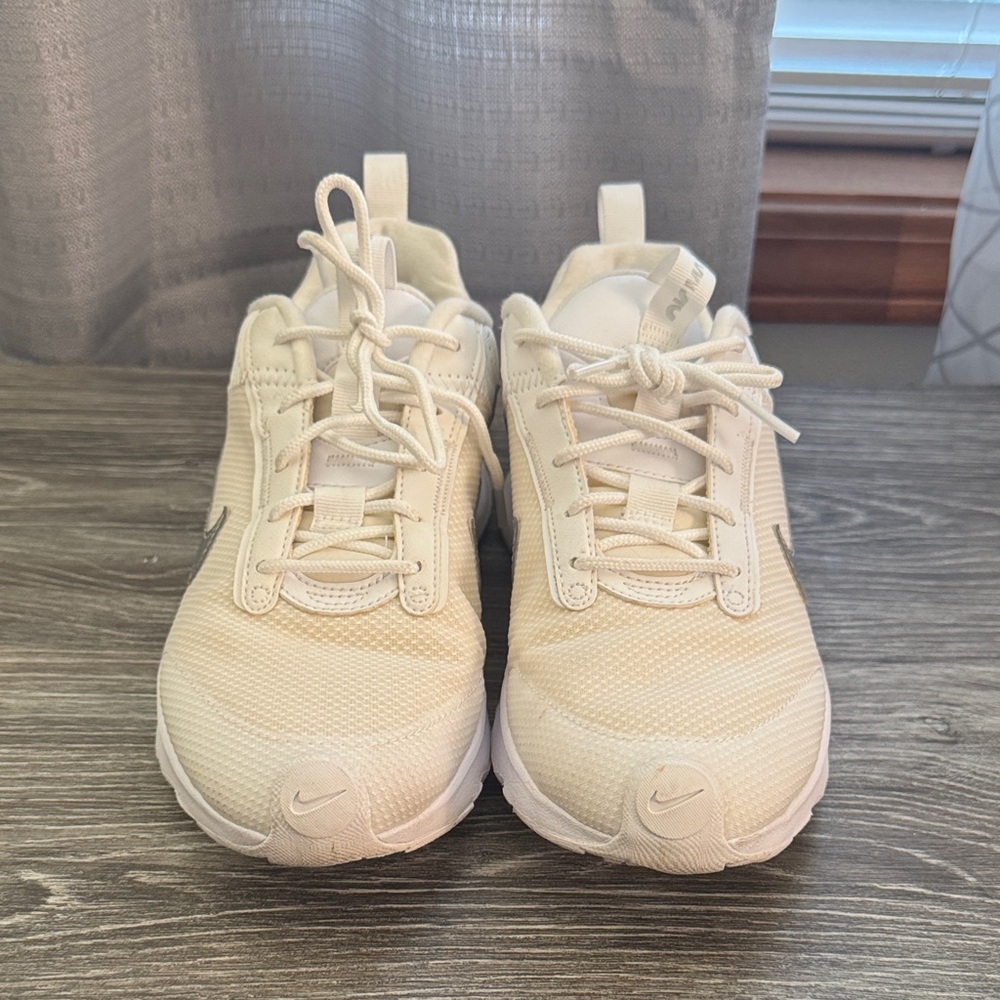 White/cream with gray accents. Womens Nikes